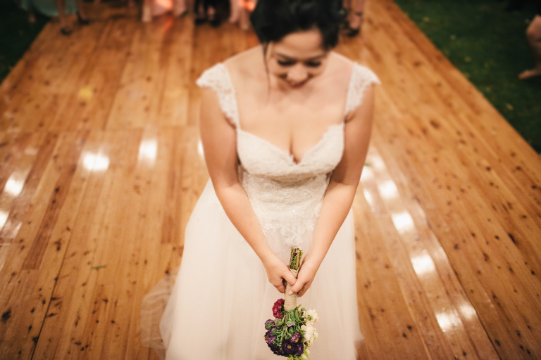 Bouquet toss outside under the stars