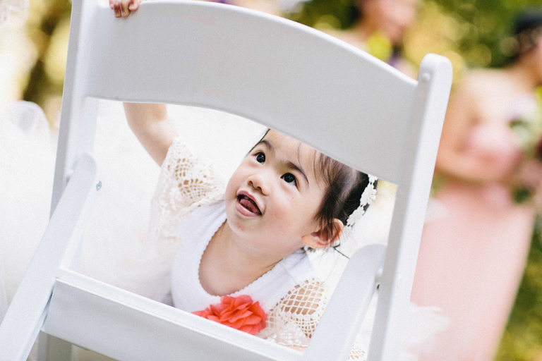 Flower girl hide and seek wedding photography
