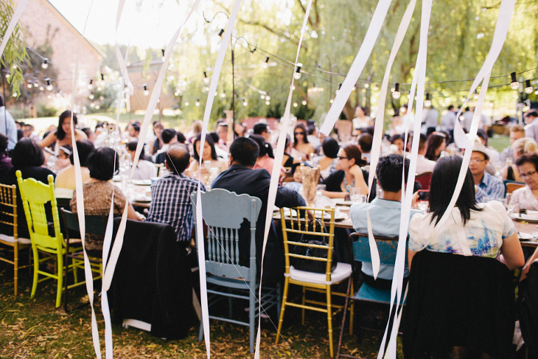 Streamers and white ribbons over reception tables
