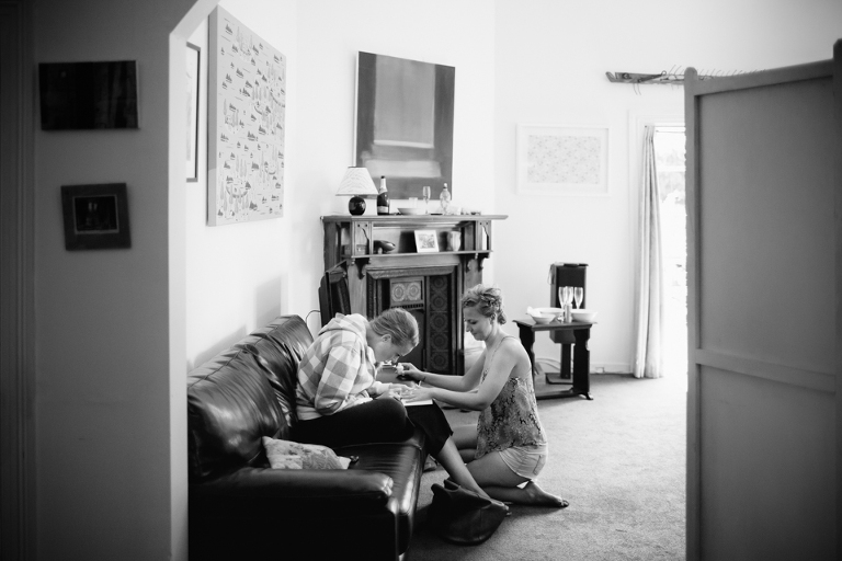 Bridesmaids putting on nail polish