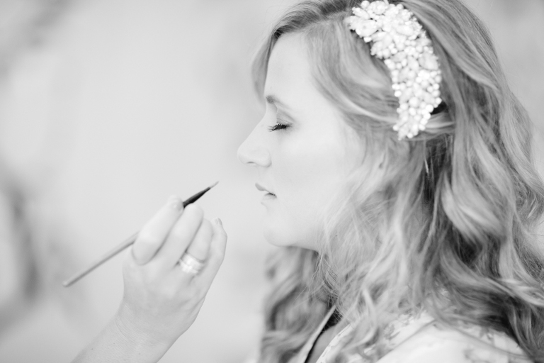 Bride getting makeup put on