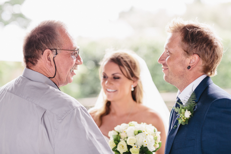bride and groom with guest natural light Te Horo Beach wedding 