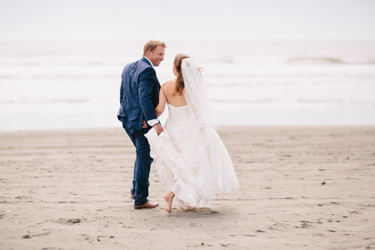 bride and groom barefoot Te Horo Beach wedding natural light