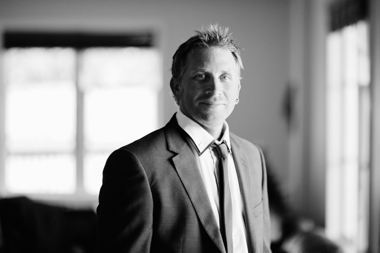 groom getting ready Te Horo Beach wedding black and white