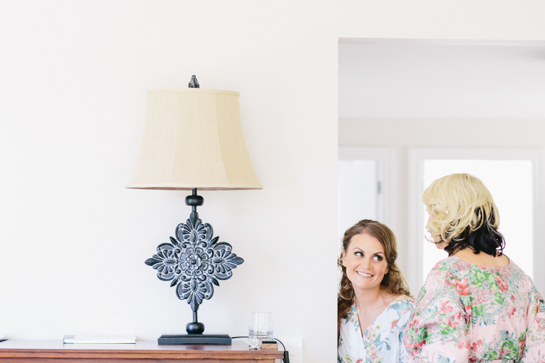 bride and bridesmaid getting ready Te Horo Beach wedding natural light