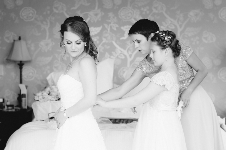 bride and flower girl getting ready Te Horo Beach wedding black and white