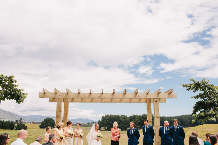 outdoor wedding ceremony with bridal party Te Horo Beach 