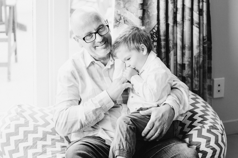 grandfather with toddler on his lap Wellington in home family photography black and white
