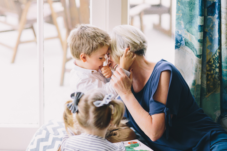 grandmother laughing and smiling with toddlers Wellington in home family photography natural light