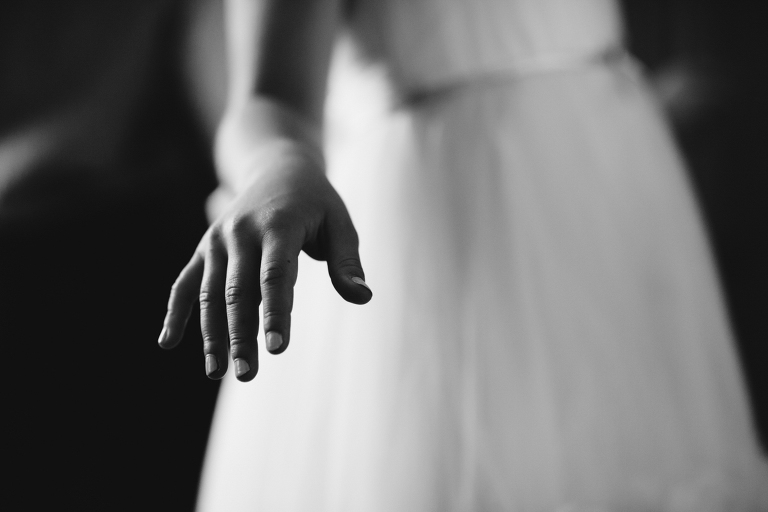 close up hand flower girl Burnside Church Martinborough Wedding black and white