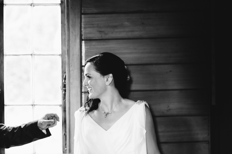 bride smiling at guest after ceremony Burnside Church Martinborough Wedding natural light 