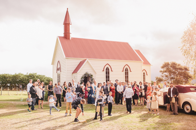 family and friends outside church after ceremony Burnside Church Martinborough Wedding natural light 