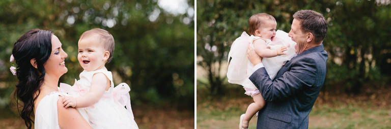 bride and groom holding baby smiling and laughing Burnside Church Martinborough Wedding natural light 