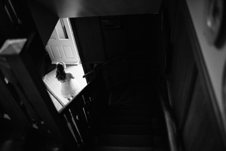 view of Flower girl from stairs Burnside Church Martinborough Wedding black and white