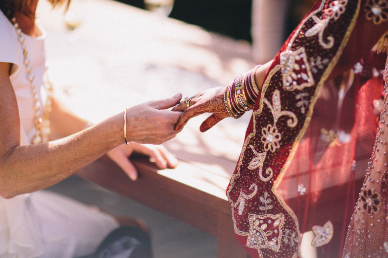 guest admiring brides ring after ceremony Pauatahanui Inlet Wellington wedding natural light