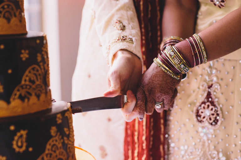 bride and groom cutting cake during reception Pauatahanui Inlet Wellington wedding natural light 