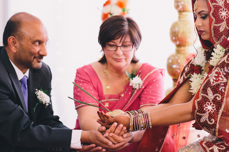 father and mother with bride during ceremony Pauatahanui Inlet Wellington wedding