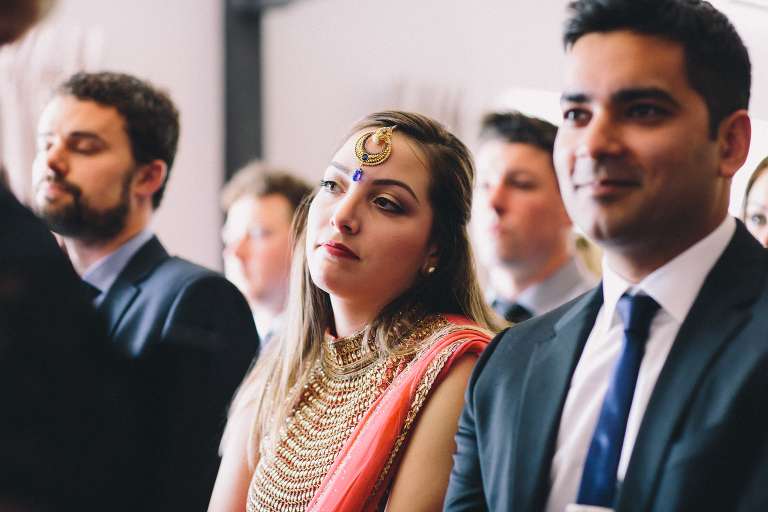 guests looking on during ceremony Pauatahanui Inlet Wellington wedding natural light
