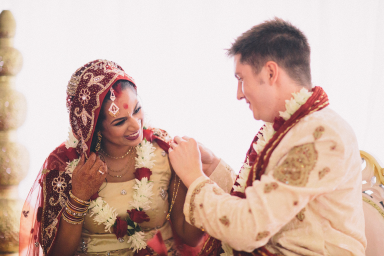 bride and groom smiling at each other during ceremony Pauatahanui Inlet Wellington wedding natural light