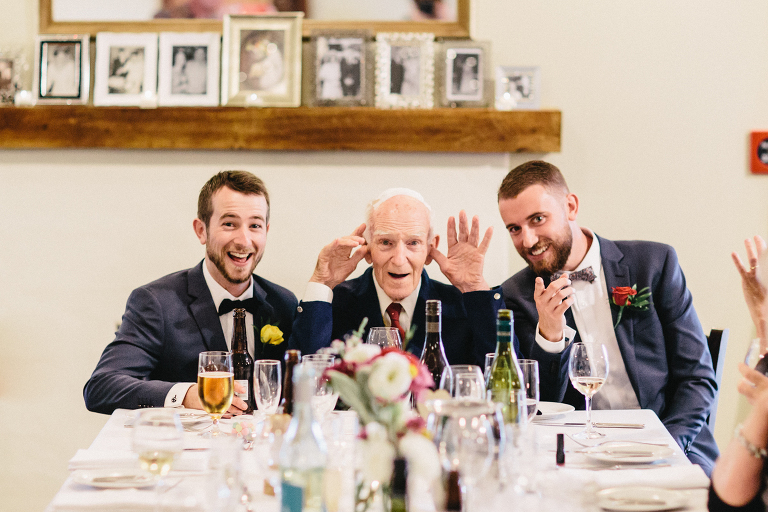 groom with family at reception Martinborough Brackenridge Estate wedding natural light 