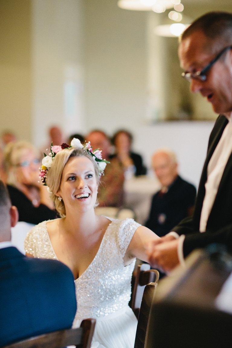 bride smiling at guest during reception Martinborough Brackenridge Estate wedding natural light 
