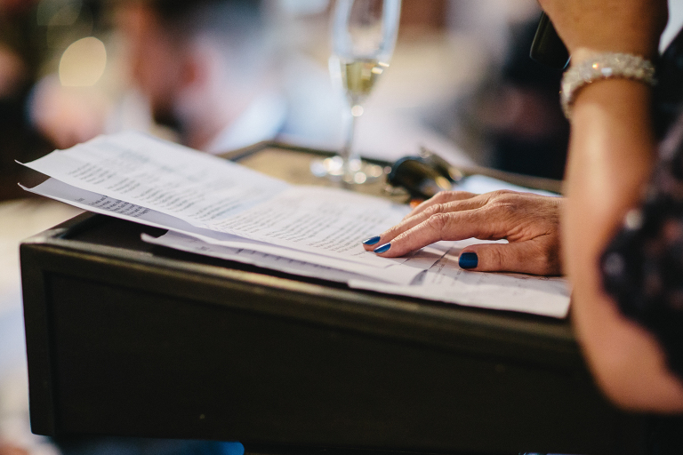 guest reading toast during reception Martinborough Brackenridge Estate wedding natural light 