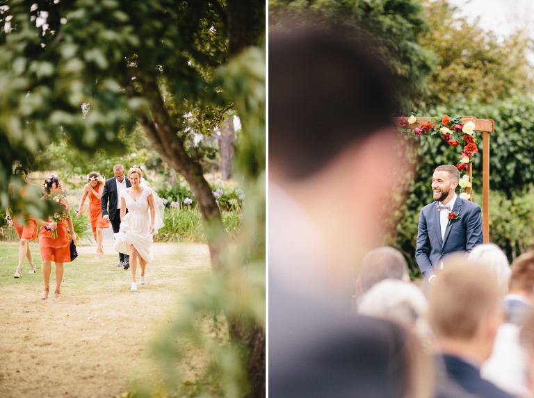bride and bridemaids walking to ceremony with groom looking on Martinborough Brackenridge Estate wedding natural light 