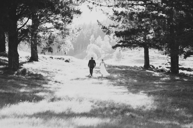 bride and groom walking down road Riversdale Wedding natural light black and white