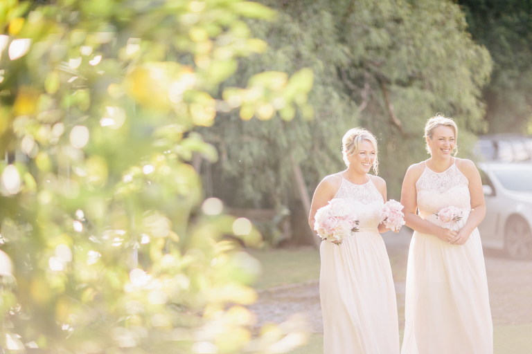 Bridesmaids smiling with bouquets outside Riversdale Wedding natural light 