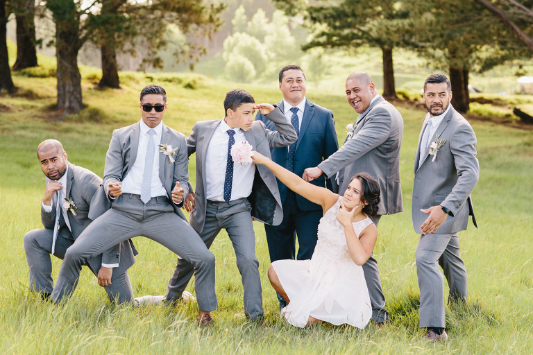 Bride and groomsmen laughing and being silly outside Riversdale Wedding natural light 