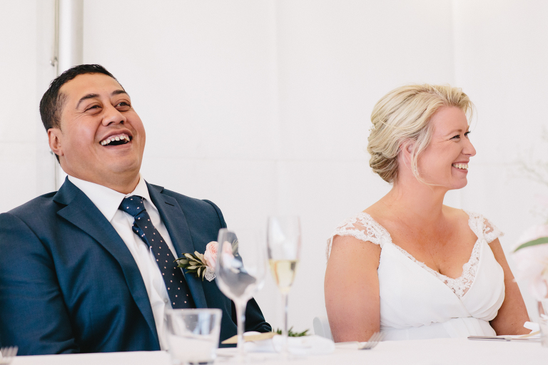groom and bride smiling and laughing at reception Riversdale Wedding natural light 