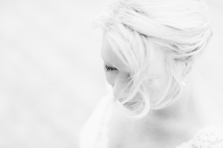 bride smiling looking down Riversdale Wedding natural light black and white