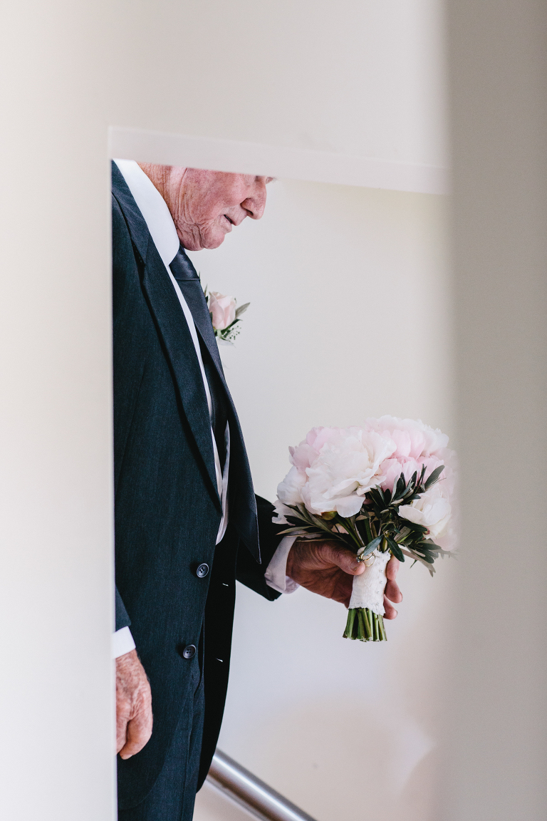 grandfather holding bridal bouquet Riversdale Wedding natural light