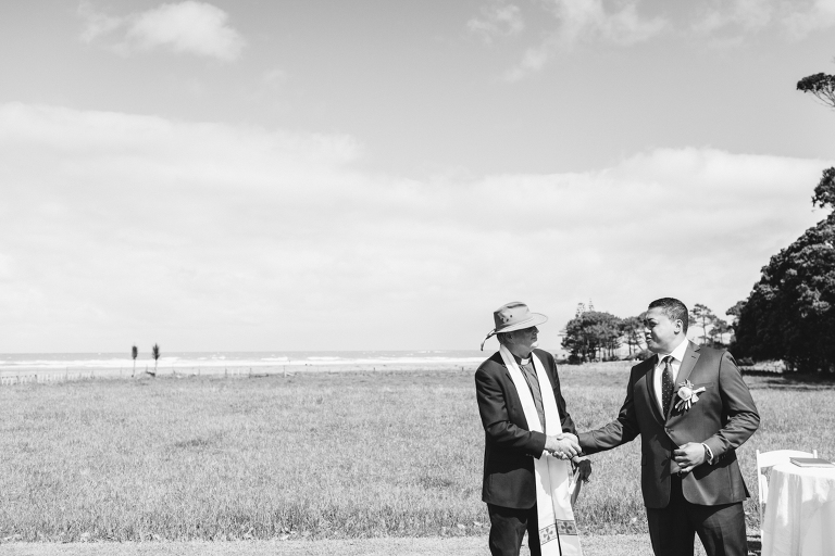 groom shaking hands with minister at ceremony Riversdale Wedding natural light