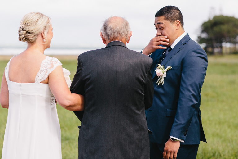 groom crying as bride walks down aisle at ceremony Riversdale Wedding natural light