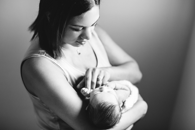 mom holding baby girl Newborn Photography Wellington natural light black and white
