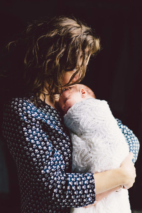 brunette mum holding newborn baby girl natural light Wellington