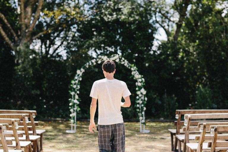 groom outside wedding site natural light Wellington rainy wedding