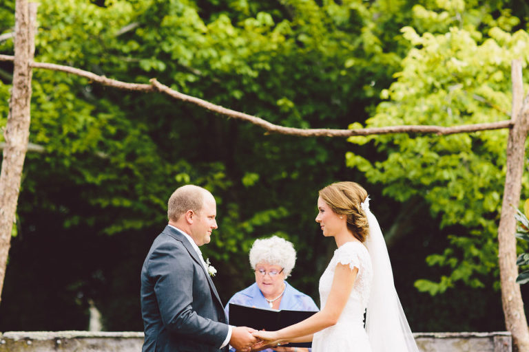 bride and groom saying vows in ceremony outside natural light Wellington wedding