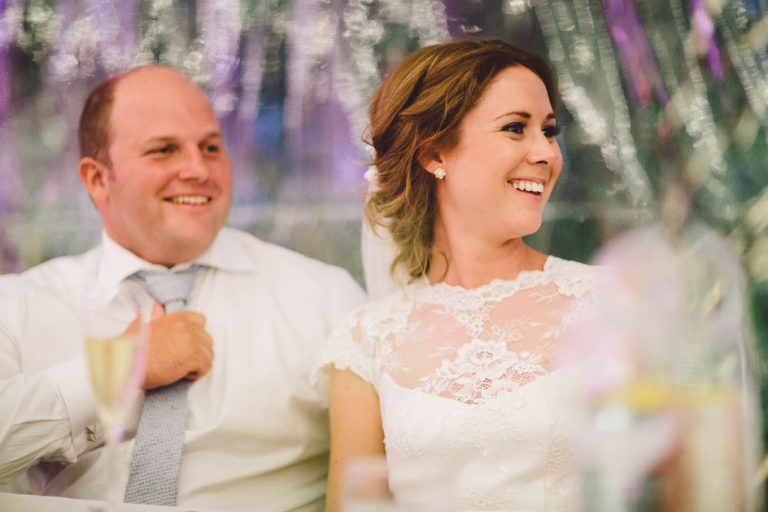 bride and groom smiling at guests natural light Wellington wedding