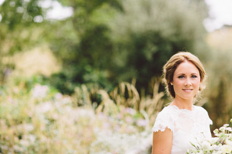 bride in field with bouquet natural light Wellington wedding