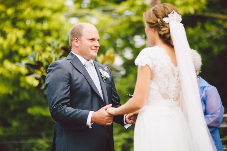 bride anfd groom holding hands during ceremony natural light Wellington wedding