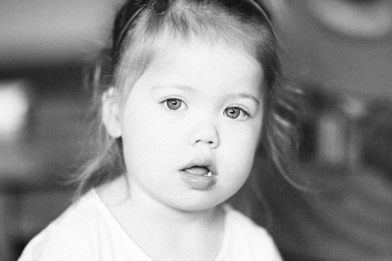 little girl staring at camera black and white natural light Wellington family photography