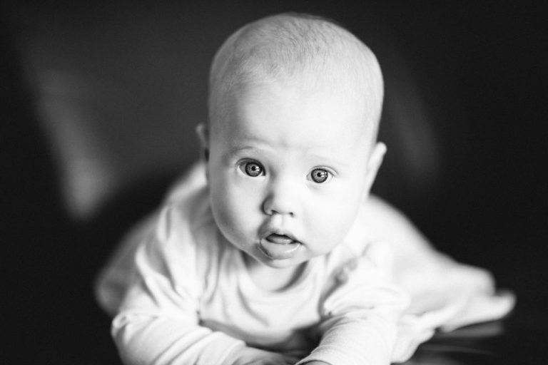 baby girl staring at camera black and white natural light Wellington family photography